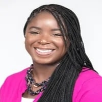 Timeka_Green from Featured seen with long black color hair and with a bright smile on her face